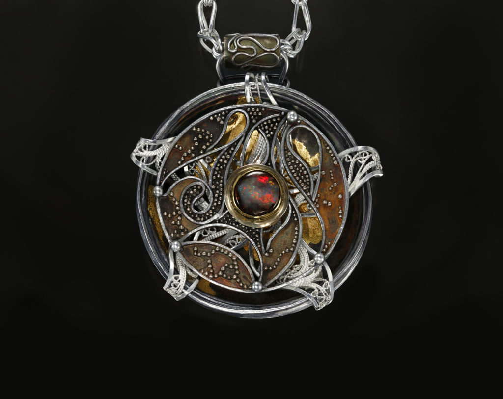 Relativity Navigator, Rotating Russian filigree, chased, granulation, and gilt pendant on a Roman chain by Victoria Lansford; photo by Pat Vasquez-Cunningham