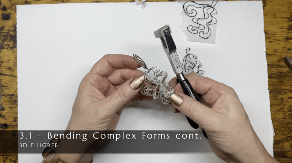 Learn how to bend filigree jewelry into complex overlapping sculpture