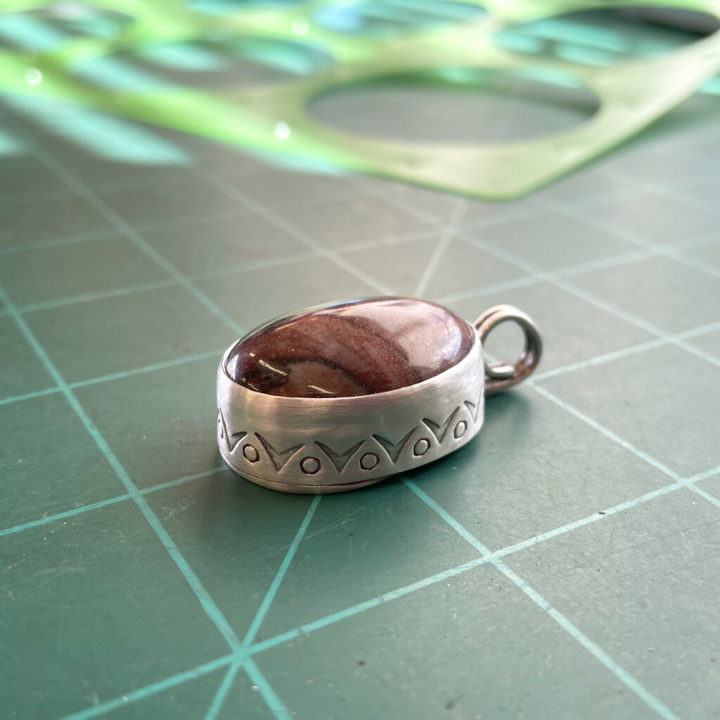 Cynthia Smutny's stamped step bezel pendant
