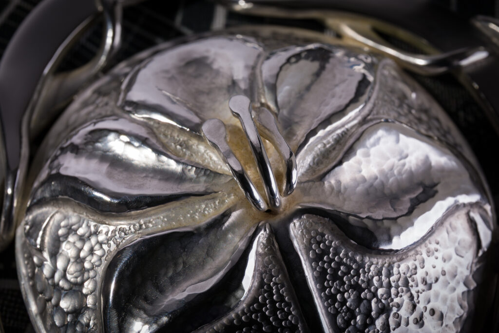Ceremonial Keys by Rauni Higson MBE – Commissioned by Sir Michael Kadoorie to commemorate the Grand Opening of the Peninsula Hotel's corporate headquarters in Hong Kong. Ceremonial Keys by Rauni Higson MBE (detail of one side of one key's bow)