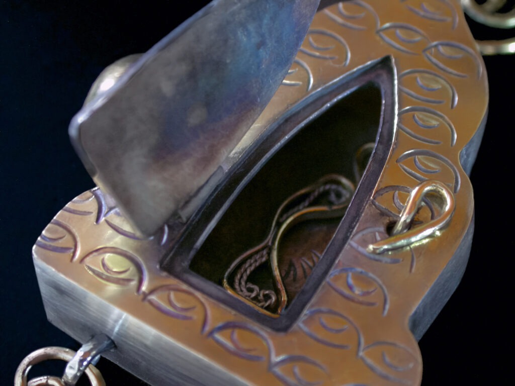 Amour, chased , Russian filigree, and fabricated amulet (open)