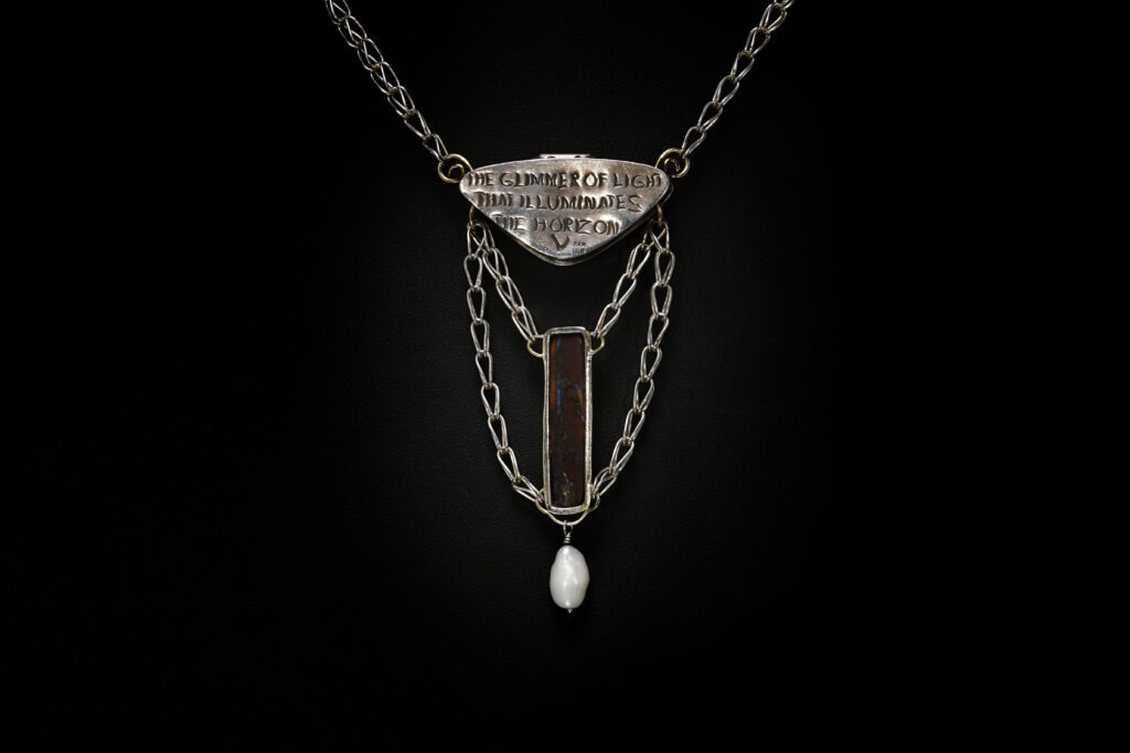 Glimmer, Russian filigree, chased, and kum boo amulet (Back)