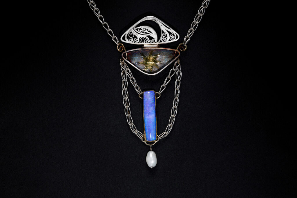 Glimmer (open), Russian filigree and chased necklace by Victoria Lansford; photo by Pat Vasquez-Cunningham