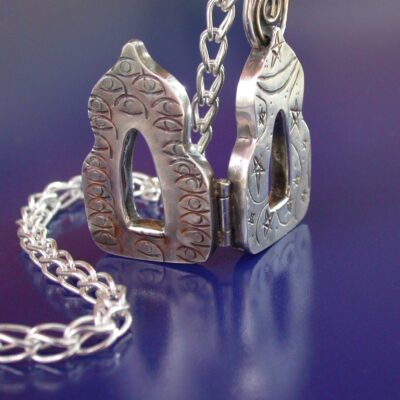 Temple of Love, Chased and keum boo amulet, suspended from a Roman chain; Sterling, fine silver, 24K gold; 1-11/16″ x 7/8″ x 1/4″, 22″ chain