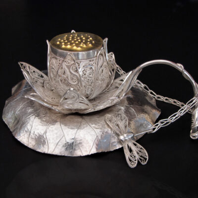 Dahling, lotus have some tea..., Russian filigree, Eastern repoussé, chased, pierced, and fabricated tea infuser, strainer, and stand, 2009; Sterling, fine silver, 22k gold/sterling bi-metal; 5 x 4 x 2.5 in