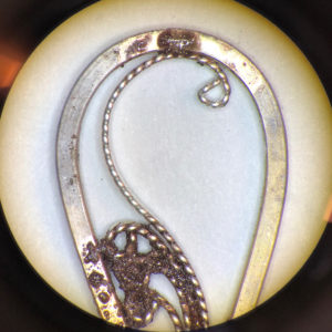 Further heating causes the solder to begin seeping into the connection points, but the solder is still grainy and has not yet flowed