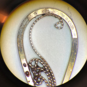 Further heating causes the solder to begin seeping into the connection points, but the solder is still grainy and has not yet flowed