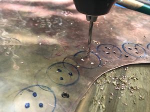 Drilling prior to hand riveting panel #3 of the right side of the Turtle Screen