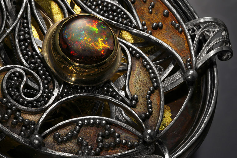 Relativity Navigator (detail), Rotating Russian filigree, chased, granulation, and gilt pendant on a Roman chain by Victoria Lansford; photo by Pat Vasquez-Cunningham