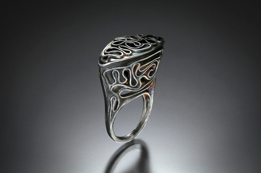 Escape II, ring by Victoria Lansford; photo by Pat Vasquez-Cunningham