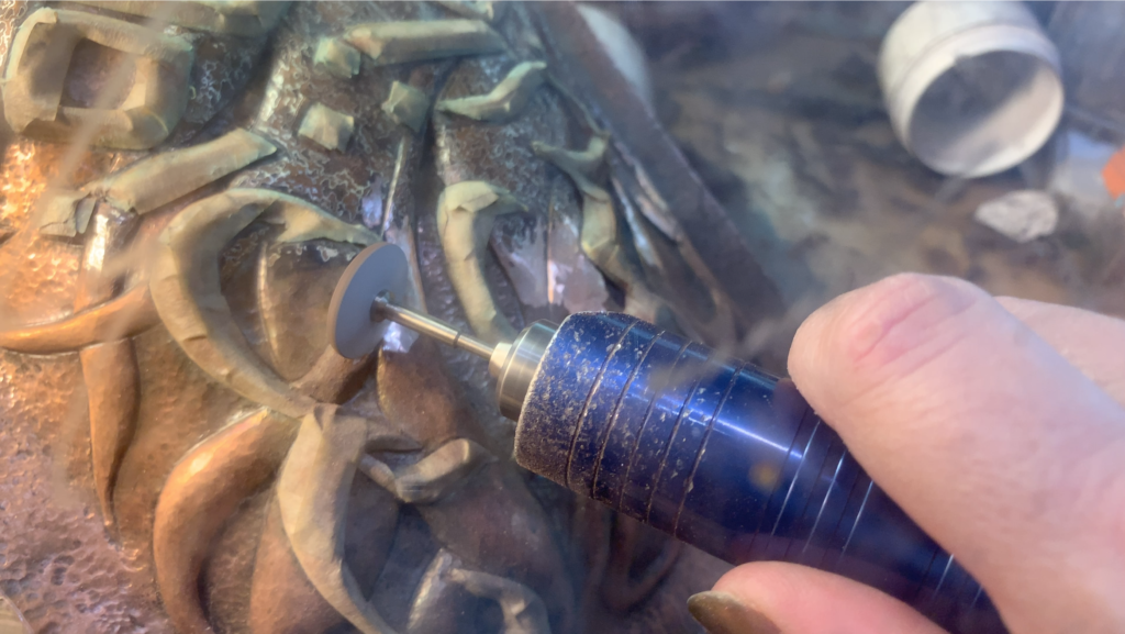 Giving Voice grinding to reveal the mokume on the metal cover