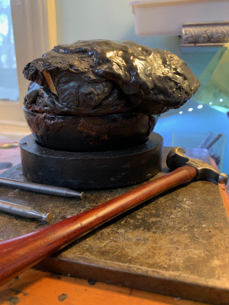 My pitch bowl + my Eastern repousse tools after completing the repousse on Giving Voice's front cover
