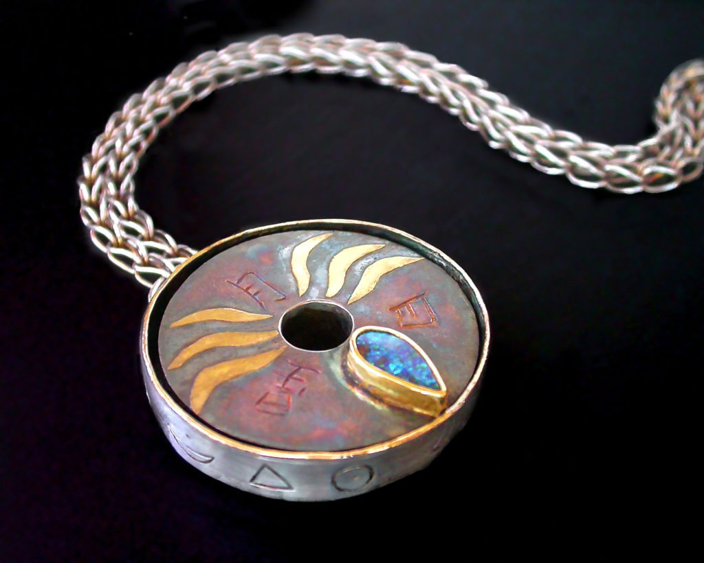 Uncertainty Principle, Filigree backed pendant on a handwoven chain by Victoria Lansford