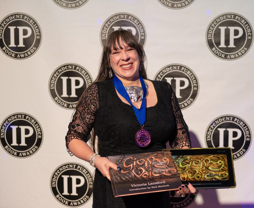 Victoria receiving the IPPY Award for Giving Voice