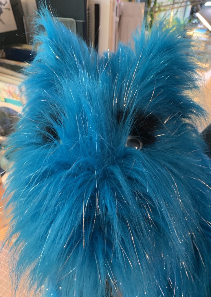 One of my favorite puppet creations, Deacon, a sparkly blue furry "Canavian" with googly eyes, wolf ears and wings