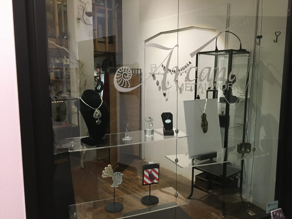 My necklace Egyptian Lily in the front window of Arcana Metalwork during the exhibit Innuendo Suggestive Jewelry
