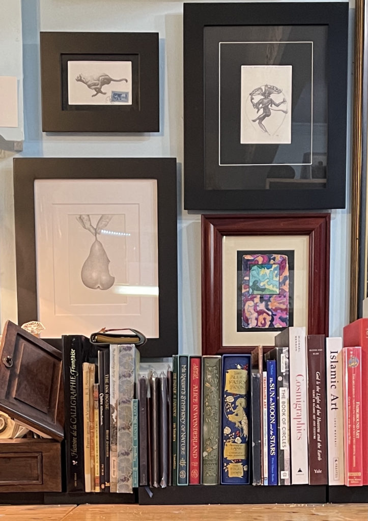 The "Bobbie-Bantock" wall of my studio featuring a "Sharpie painting" from Bobbie Crow's Tornado series and drawings by Nick Bantock