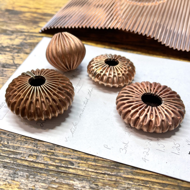 Corrugated metal bead prototypes made by Victoria Lansford in Cynthia Eid's workshop