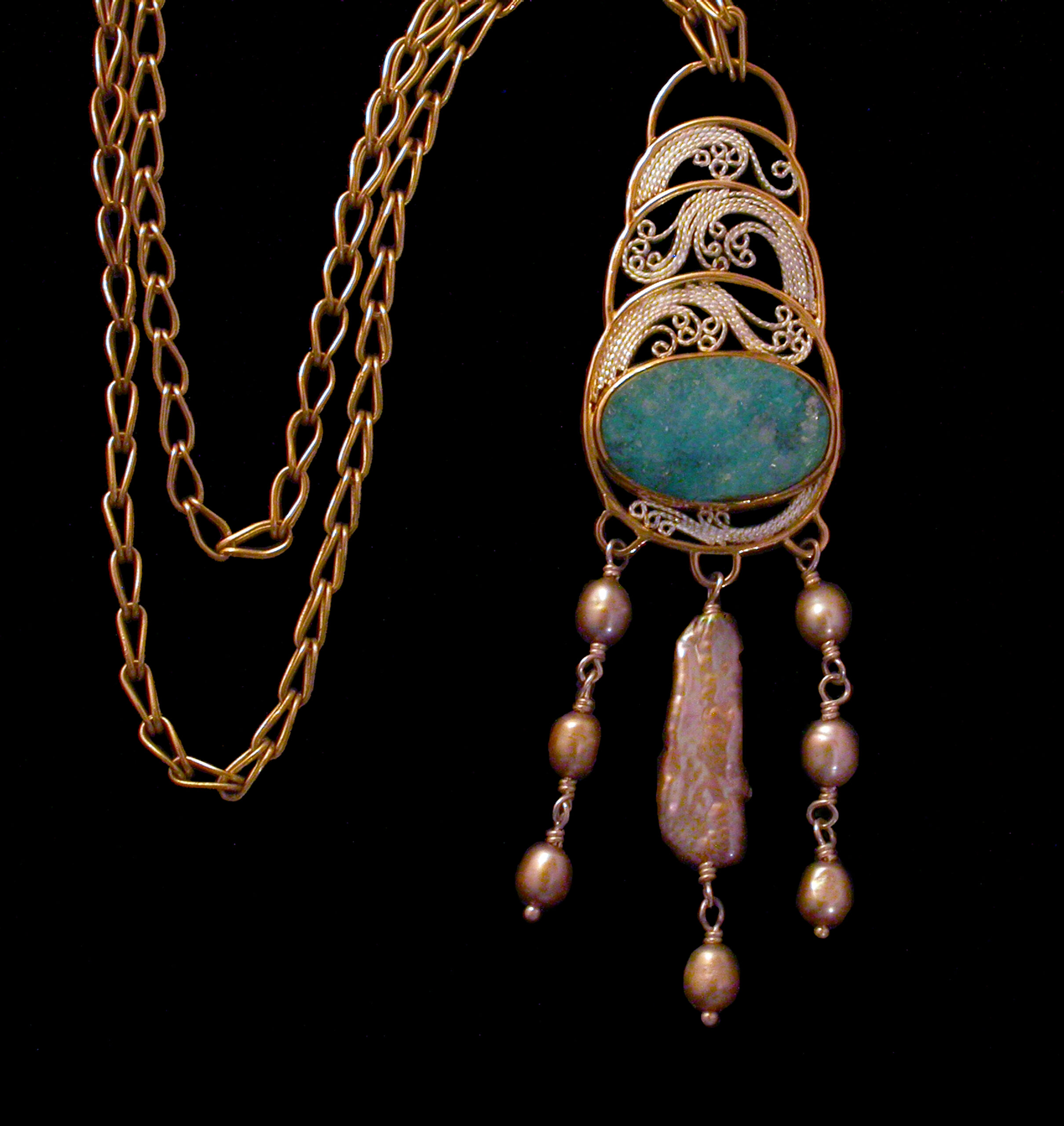 Delicate filigree fills the crescent phases, surrounding a naturally formed chrysocolla drusy, framed in 18K and 22K gold with a fall of naturally golden Biwa and baroque pearls and suspended from a hand-fused loop-in-loop chain.