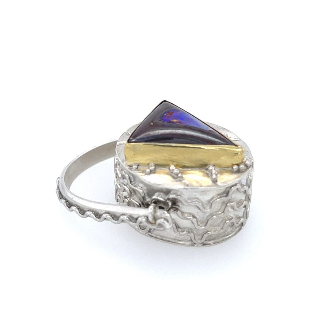 Cake II, showing the top and side of the Rotating Bezel Ring