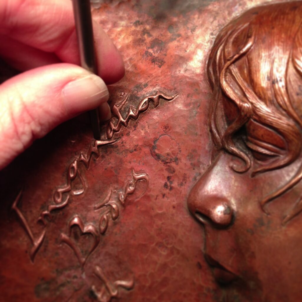 Imagination Bodies Forth, Eastern repousse copper artist book cover with my son Skyler's portrait and lettering in progress Er1