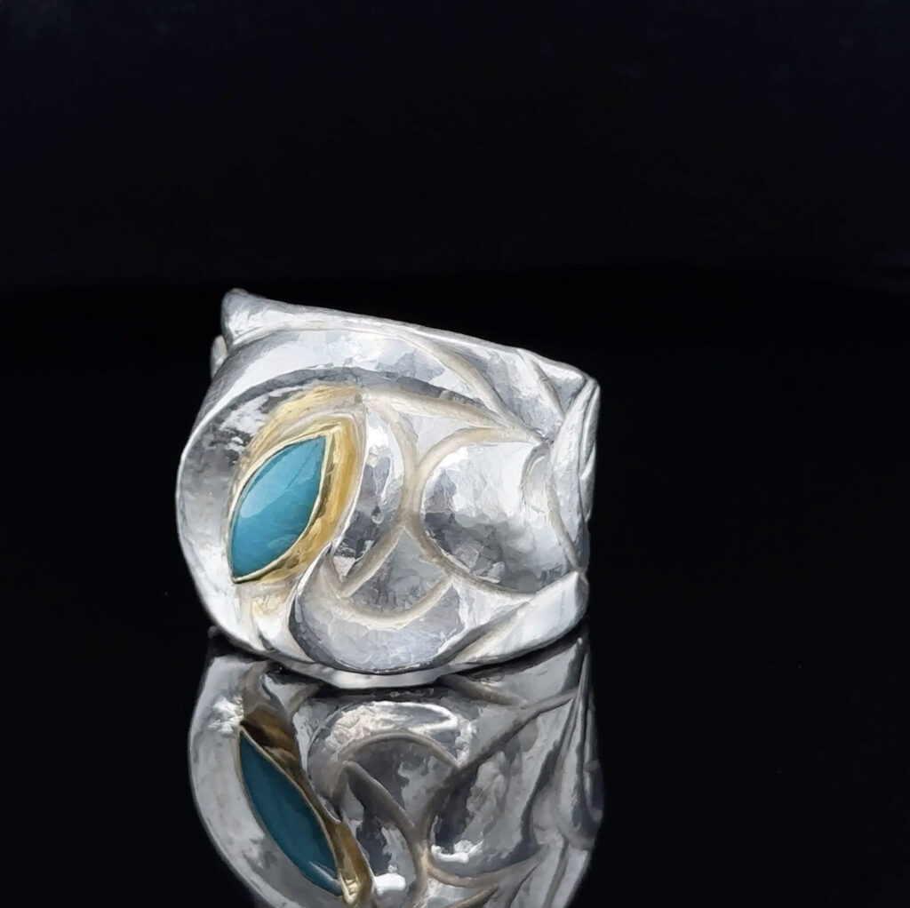 Eastern Repoussé Ring of sterling with 22 karat set gem silica
