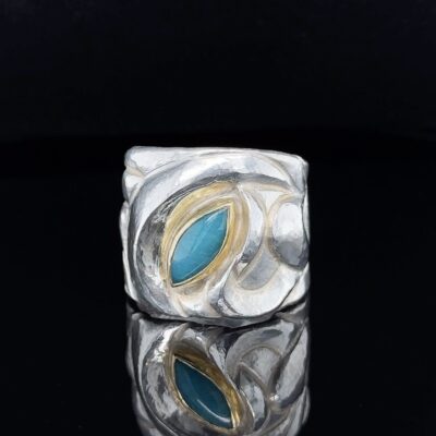 Eastern Repoussé Ring of sterling with 22 karat set gem silica