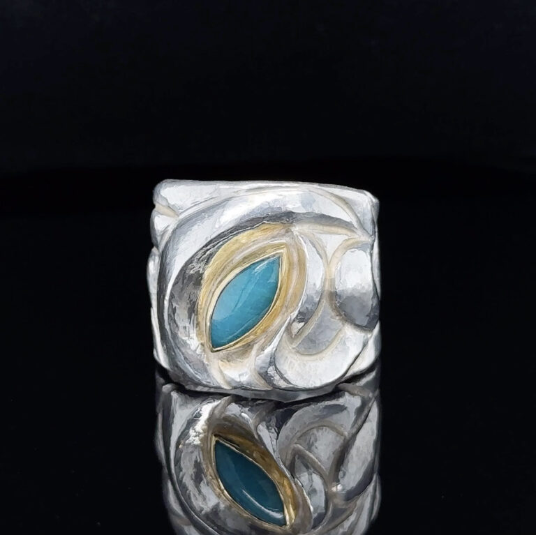Eastern Repoussé Ring of sterling with 22 karat set gem silica