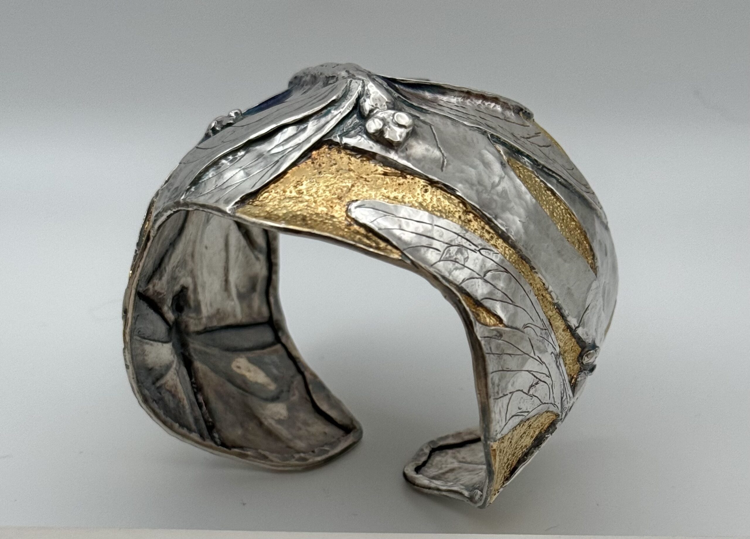 Unique chased cuff bracelet featuring the artistry of Eastern repoussé by Judi Schwartz