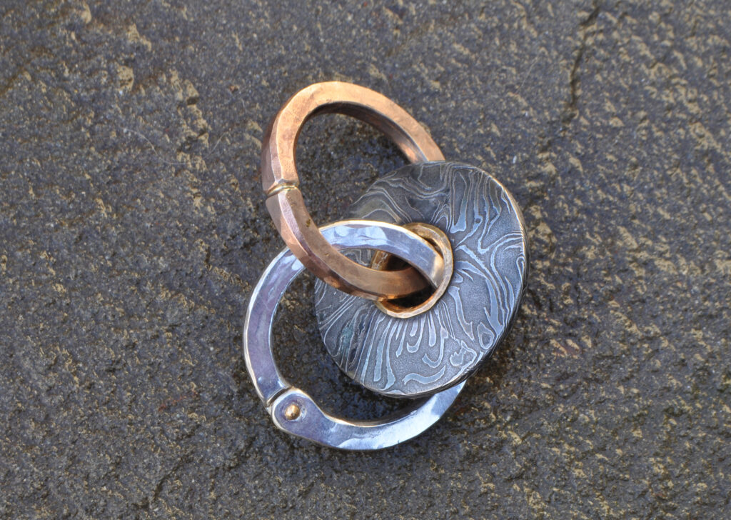 Ancient Linking, Casting, forging, welding, gold overlay, ​ riveting, tool making, soldering, patination. Pattern-welded steel, coin silver, classic ​ bronze, 24 K & 22K gold, 14K gold solder.