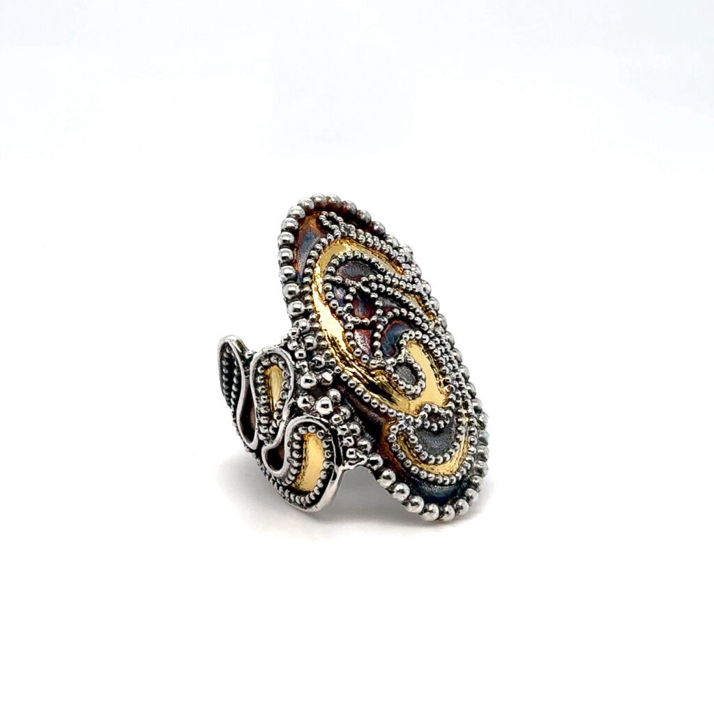 An artistic portrayal of a contemporary ring adorned with exquisite granulation and keum boo techniques, highlighting the fusion of ancient craftsmanship with modern design