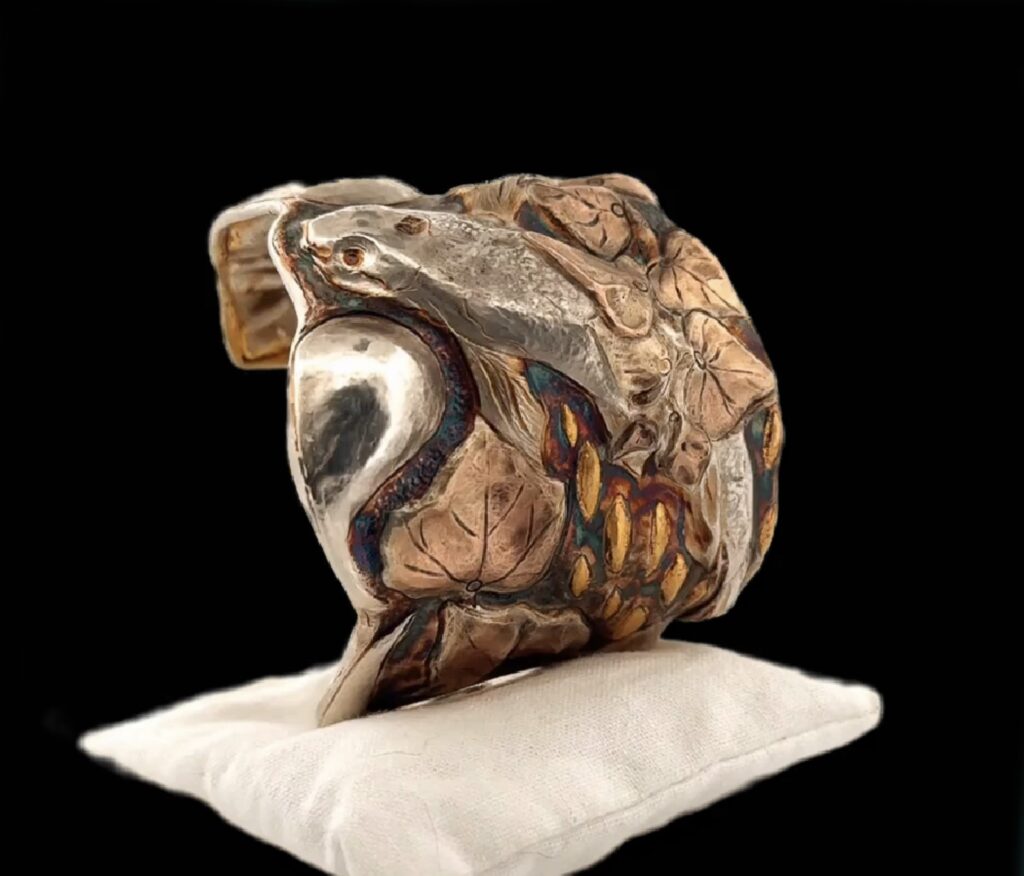 Handcrafted chased cuff bracelet showcasing intricate Eastern repoussé technique