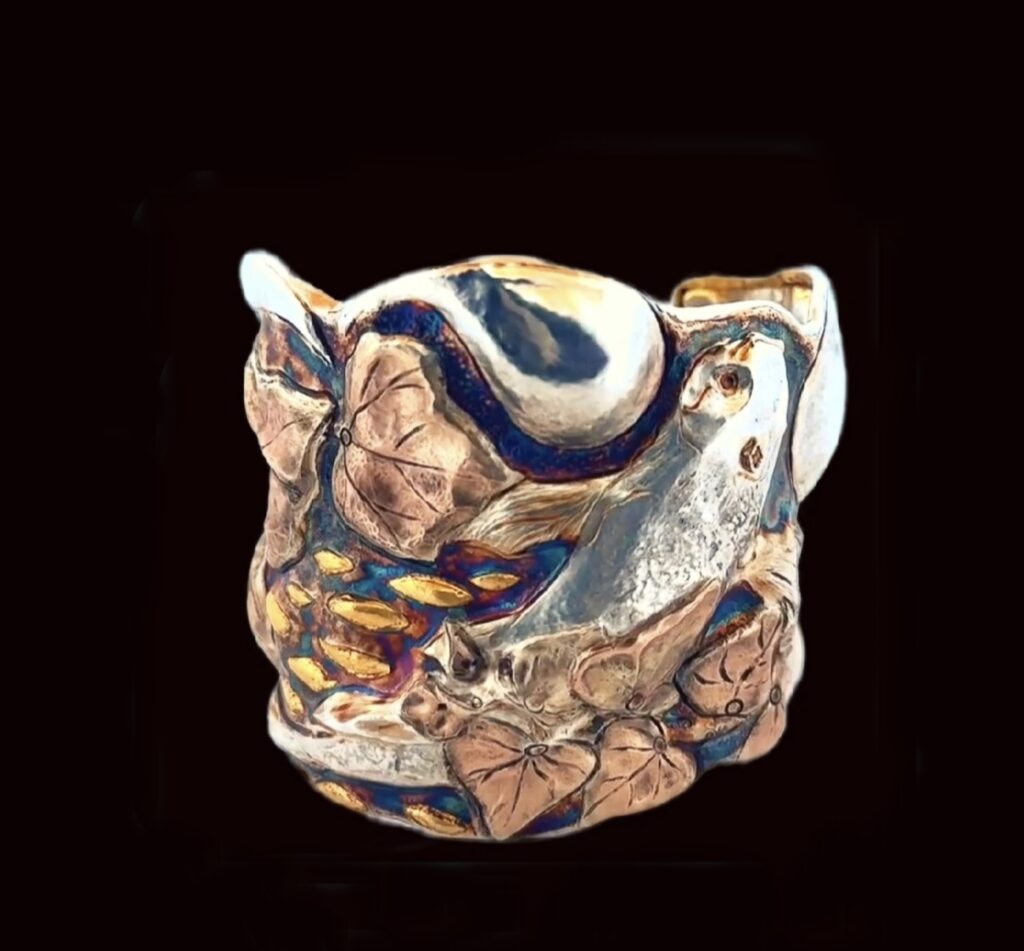 Exquisite handmade cuff bracelet adorned with a beautifully chased pattern