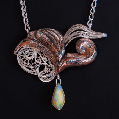 Passion Made Visible Bottom left Russian filigree and Eastern repoussé patterned mokume gane pendant on a Roman chain, 2011 Sterling, fine silver, copper, shibuichi, 22k gold, Koroit opal 2.5 x 3 x 0.375 in, 18 in. chain