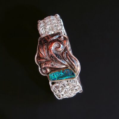 Foliage Bottom right Original pattern side weave mesh chain bracelet with a clasp of Eastern repoussé patterned mokume gane, 2012 Fine silver, sterling, copper, shibuichi, 22k gold, Koroit opal 7.25 x 1.375 x 0.5 in Collection of Joele Connolly