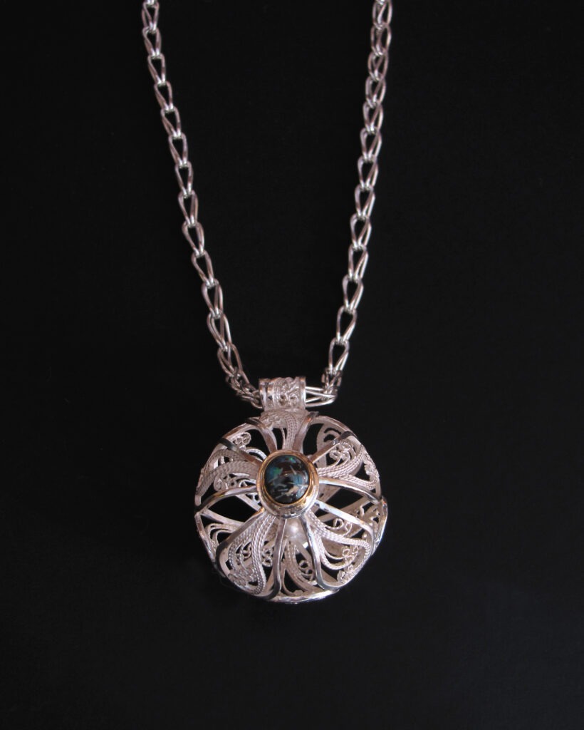 Orb V, Russian filigree pendant with Koiroit opal on a Roman chain, 2010; sterling, fine silver, Koroit opal