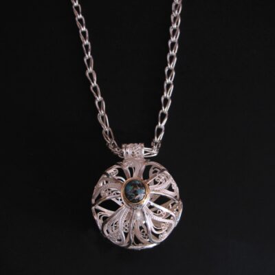 Orb V, Russian filigree pendant with Koiroit opal on a Roman chain, 2010; sterling, fine silver, Koroit opal