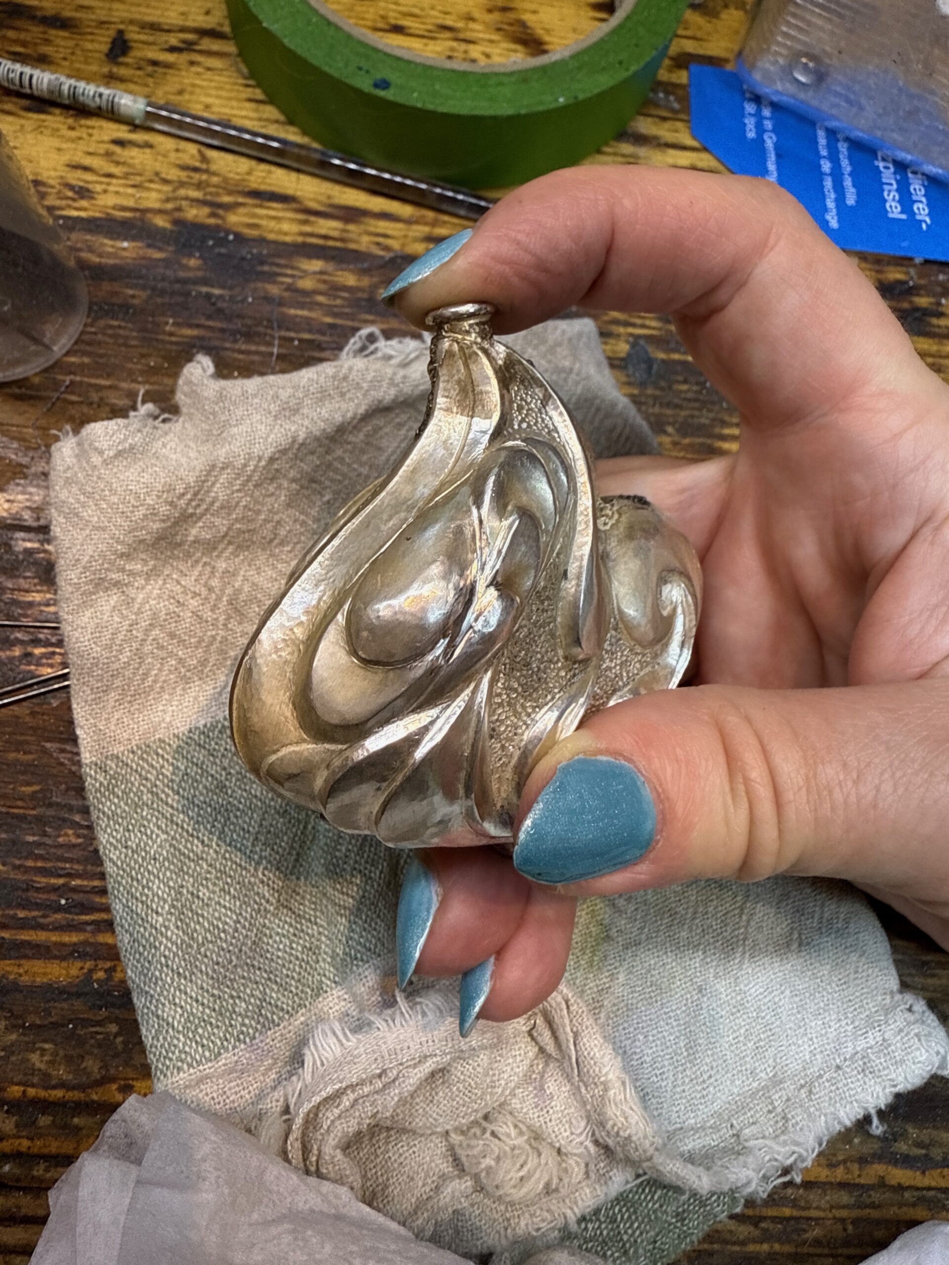 Femina, Eastern repousse and Bonny Doon hydraulic press relief perfume bottle, in progress with the neck soldered in place