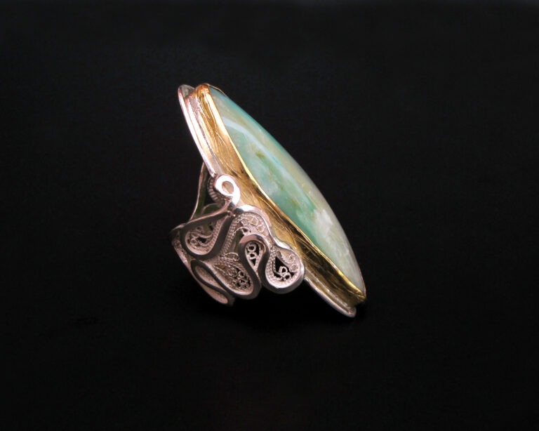 Riptide, filigree ring with maze style shank and chased bezel, 2010; 22k gold, sterling, fine silver, Peruvian opal; private collection