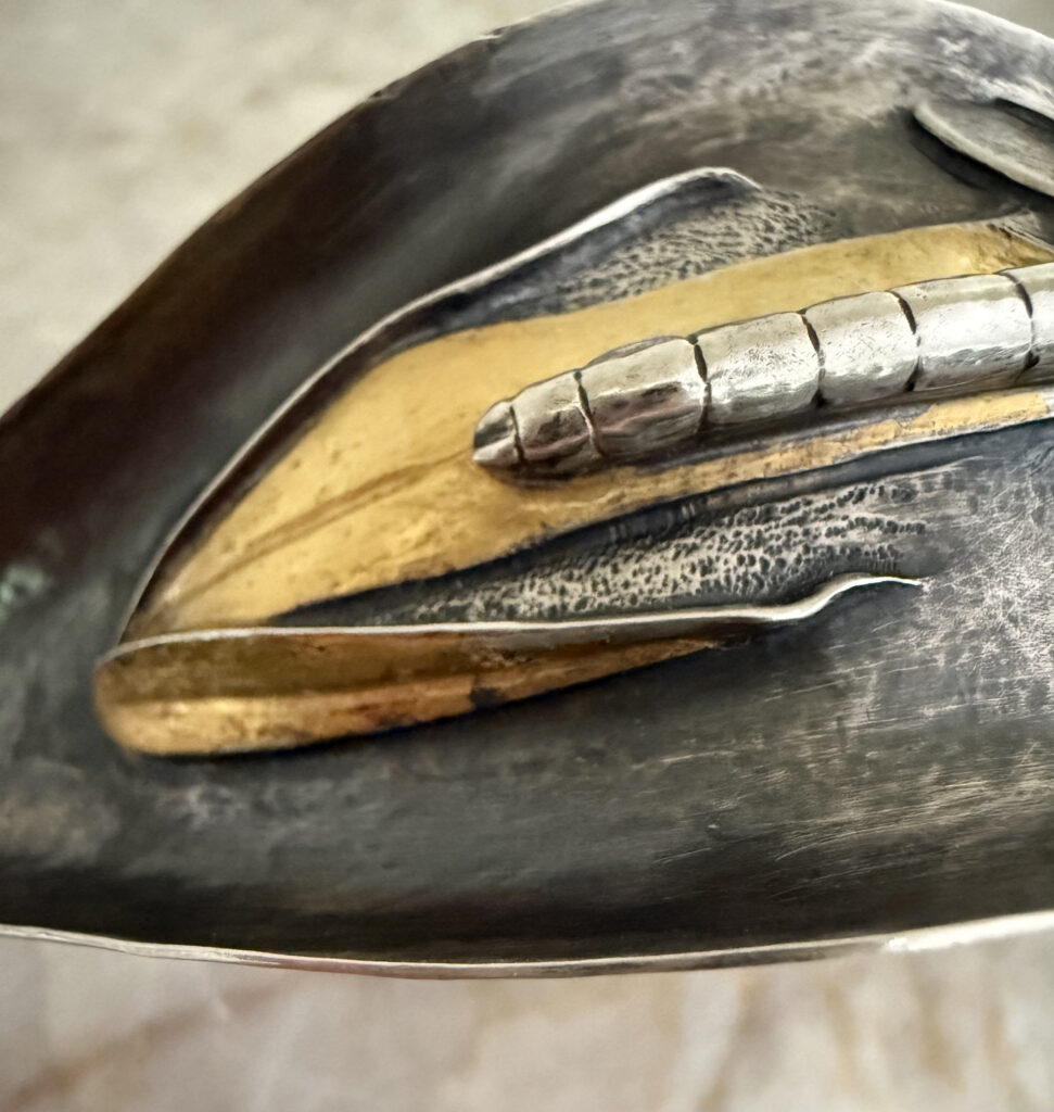 Anticlastic & Eastern repoussé ladle by Judi Schwartz (detail); Yes, it's really hammered from a single sheet of sterling silver! She puffed up the leaves then chased them to have those incredibly realistic edges.