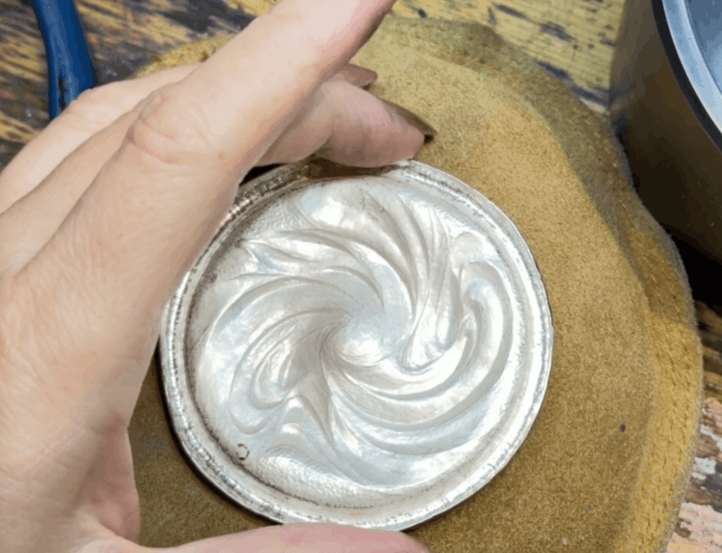 Eccentricity Compass' Eastern repoussé base in shakudo-sterling bi-metal (back view)