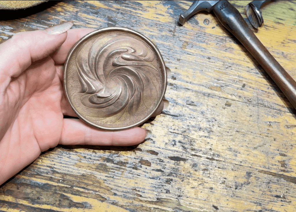Eccentricity Compass' Eastern repoussé base in shakudo-sterling bi-metal, front view with folded rim...Yes! Folding edges in relief is one of my super powers (and super fun to do)!
