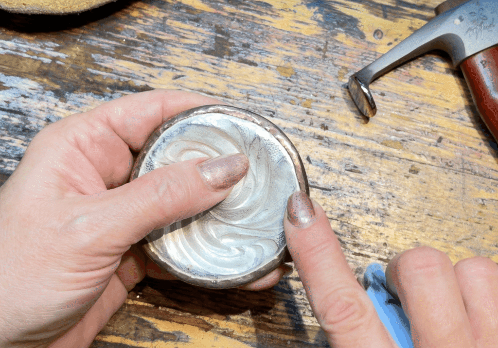 Eccentricity Compass' Eastern repoussé base in shakudo-sterling bi-metal, after I folded over the rim from the front